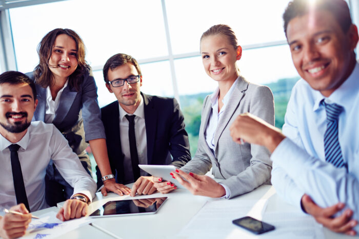 Smiling businesspeople having business meeting