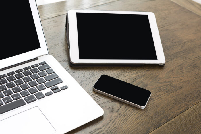 Technological devices wooden table